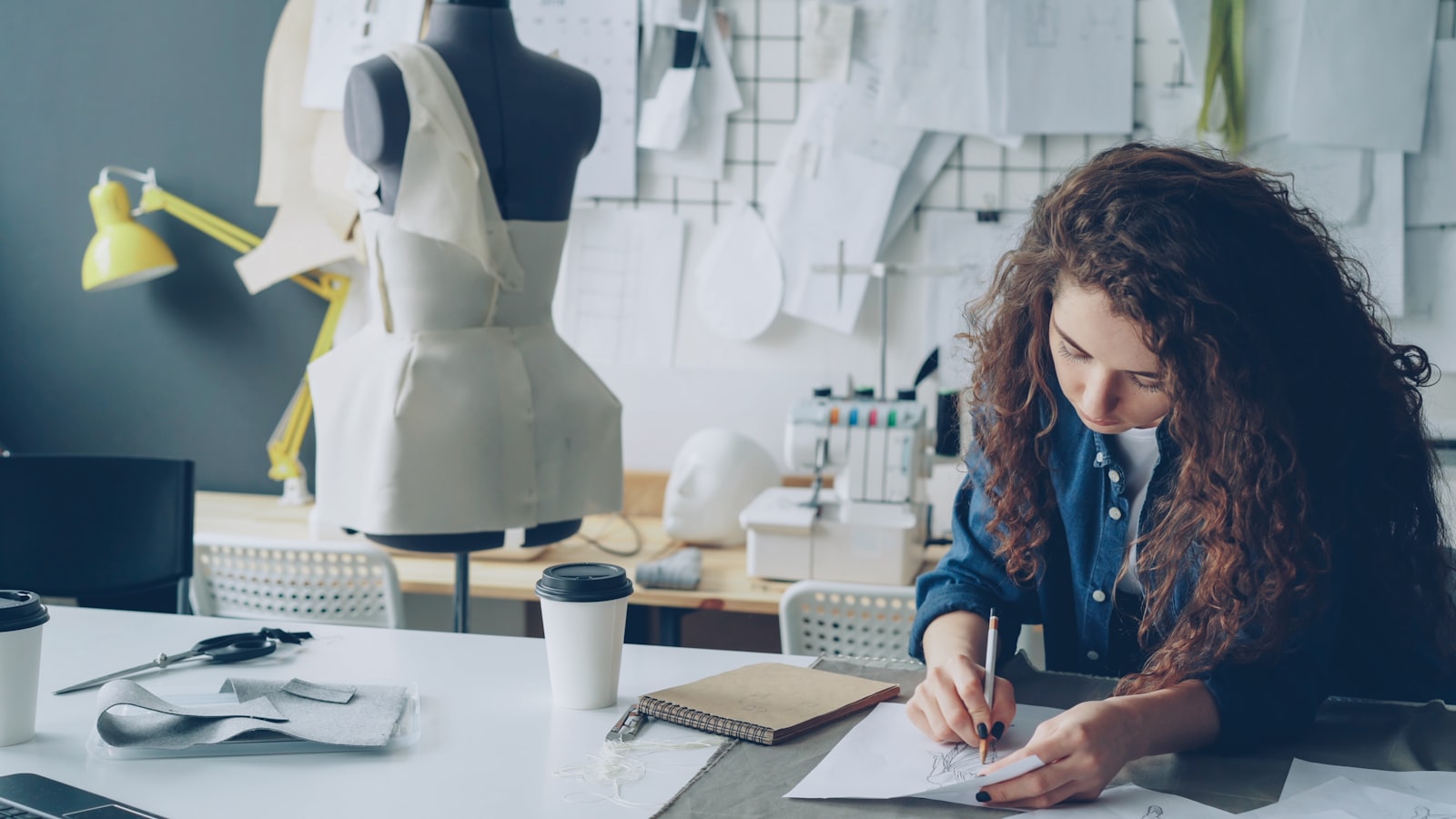 Fashion designer working on a new garment in a studio
